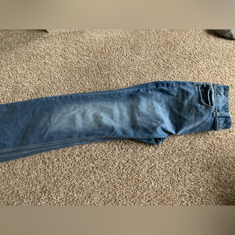 Used boot, cut jeans, no rips, and no stains